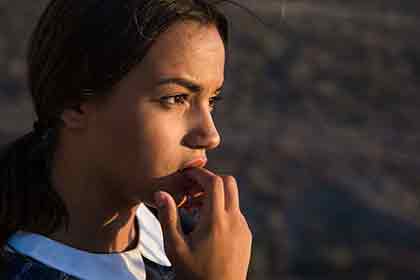  A photo of a beautiful Latina woman who seems to be contemplating about something