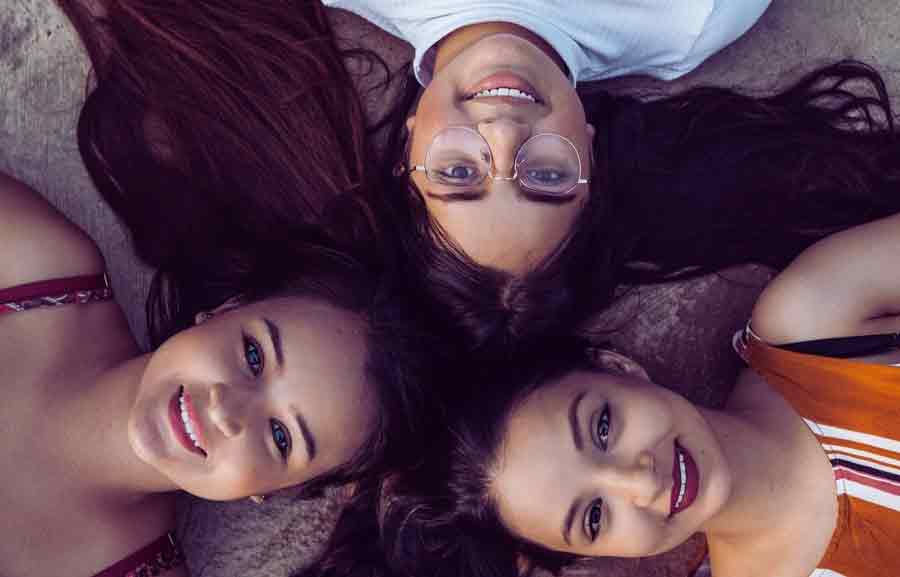  A group of women smiling.