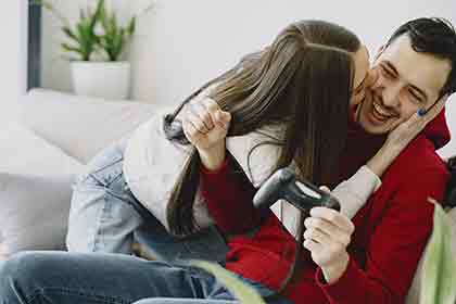 Man and woman playing video game