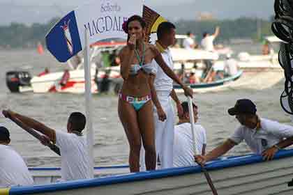 beautiful Colombian woman standing on a boat